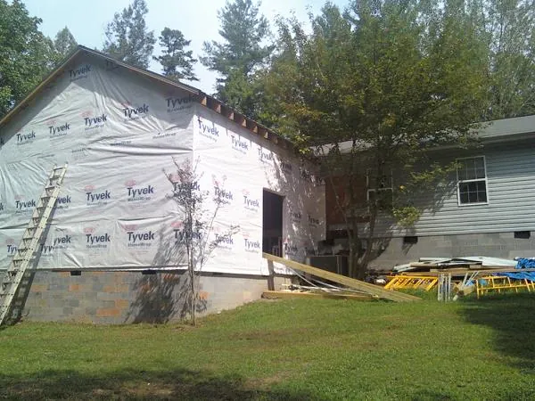 Tyvek wrapped gable on a new room addition beside an existing home in Hephzibah
